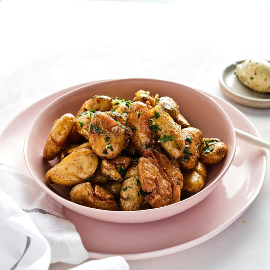 ROASTED BABY POTATOES, CONFIT GARLIC, ROSEMARY.