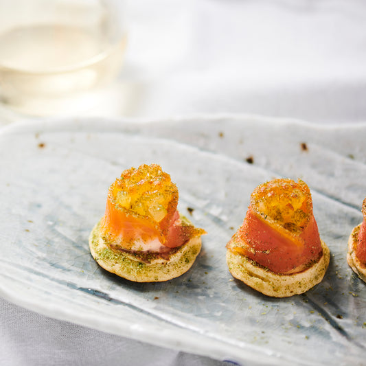 SALMON BLINI, CULTURED CREAM, PICKLED SHALLOTS,  DILL. (40)