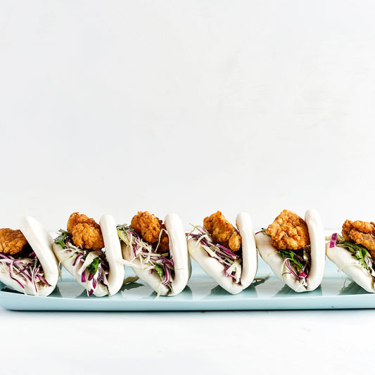 POPCORN CHICKEN BAO, CHIPOTLE MAYO, CABBAGE SLAW, PICKLED CUCUMBER (30)