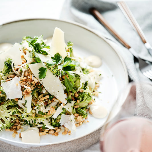 CABBAGE AND BROCCOLI SLAW, PARMESAN, TOASTED PINE NUTS, LEMON VINAIGRETTE.