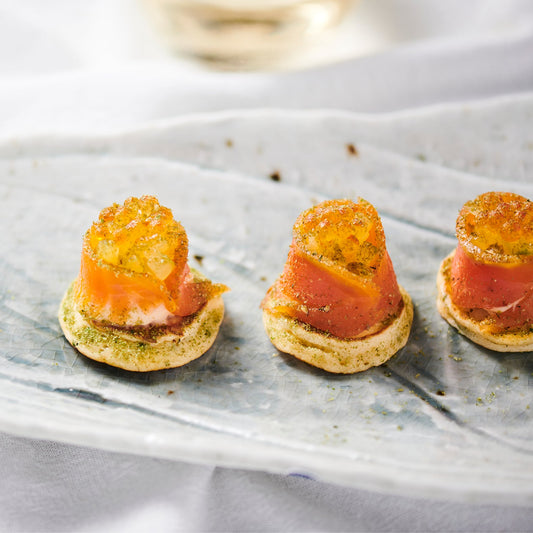 SALMON BLINI, CULTURED CREAM, PICKLED SHALLOTS,  DILL. (40)