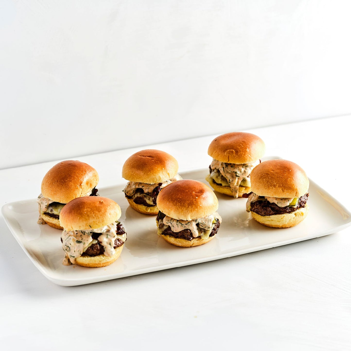 MINI ANGUS CHEESEBURGERS, CHEESE, PICKLES & KETCHUP (24)