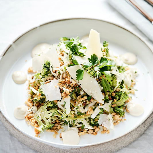 CABBAGE AND BROCCOLI SLAW, PARMESAN, TOASTED PINE NUTS, LEMON VINAIGRETTE.