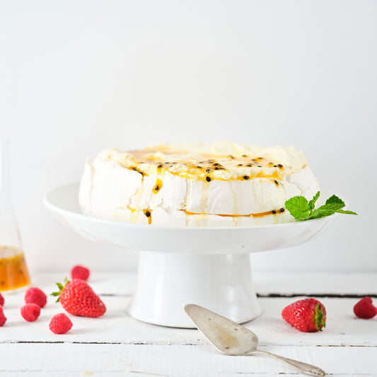 STRAWBERRY, PASSIONFRUIT & TOASTED COCONUT PAVLOVA.