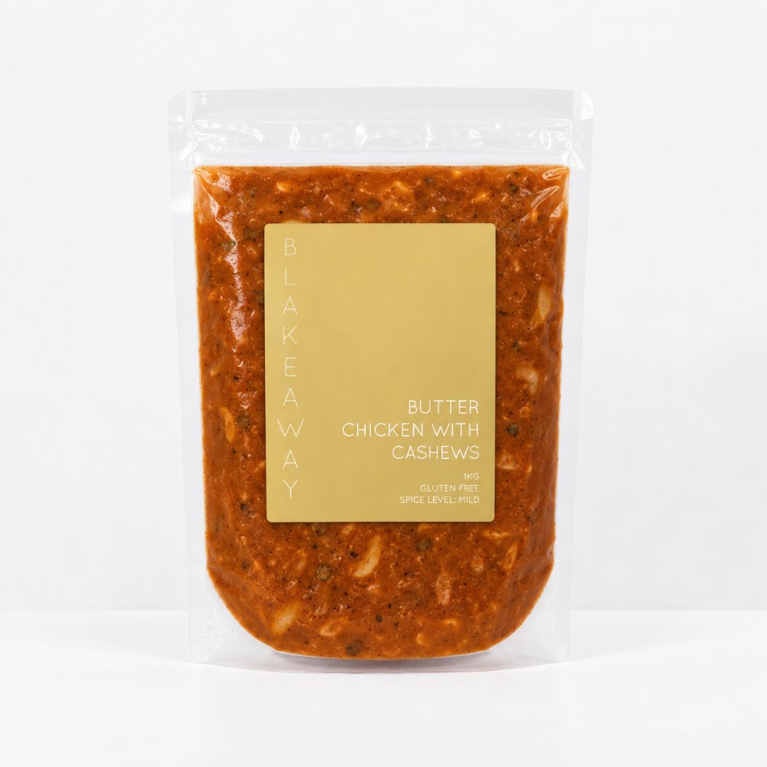 A clear stand-up pouch containing a chunky orange-brown sauce labeled 'BLAKEWAY BUTTER CHICKEN WITH CASHEWS' on a white background.