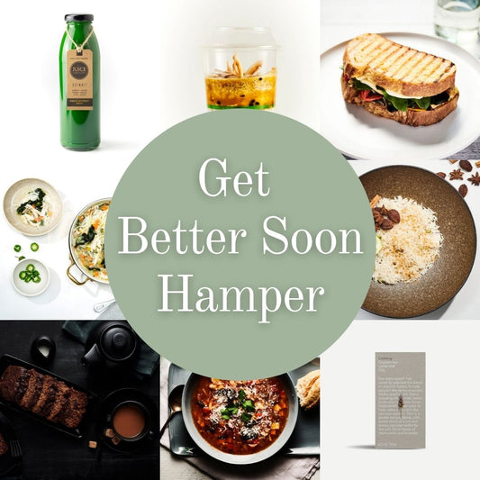A promotional collage for a hamper with a large central sage-green circle reading 'Get Better Soon Hamper' over a grid of assorted food items and a small product card. Visible items include a green bottle, a sandwich on a plate, bowls of soup and pasta, a dark plate with rice and nuts, and a small card on a white background.