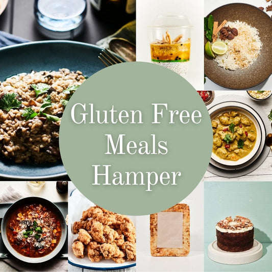 A collage of various gluten-free meals, snacks, and desserts arranged around a central sage green circle with the text 'Gluten Free Meals Hamper'. The surrounding food items include fragrant rice, seasonal risotto, sri lankan chicken curry, minestrone soup, popcorn chicken, gluten-free lasagne and a carrot cake with cream cheese frosting.