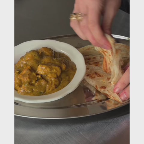 sri lankan chicken curry with paratha bread