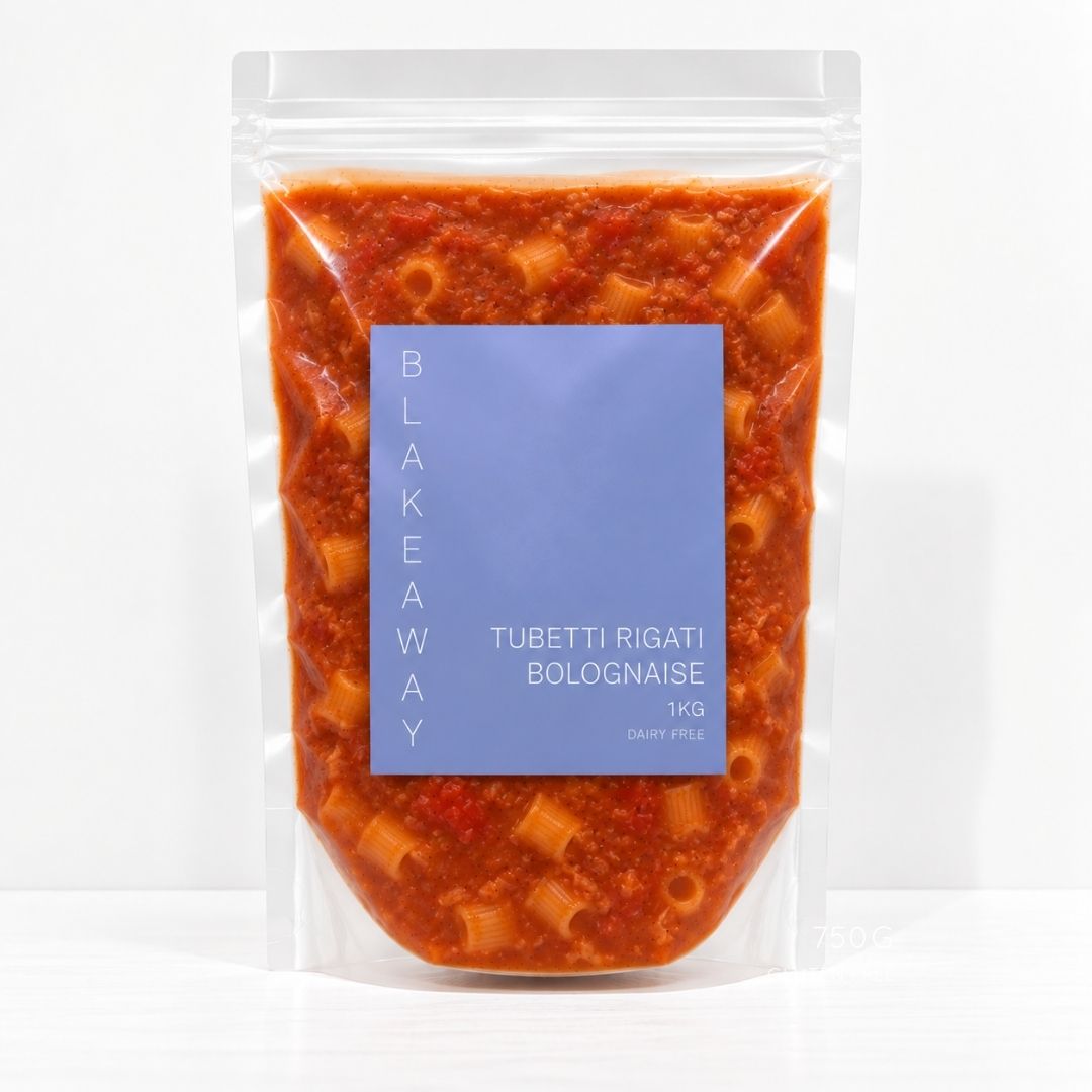 A clear stand-up pouch containing cooked pasta and red sauce, with a large blue label reading 'BLAKEYAWAY' and 'TUBETTI RIGATI BOLOGNAISE 1 KG'.