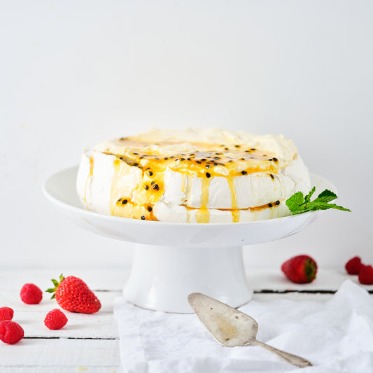STRAWBERRY, PASSIONFRUIT & TOASTED COCONUT PAVLOVA.